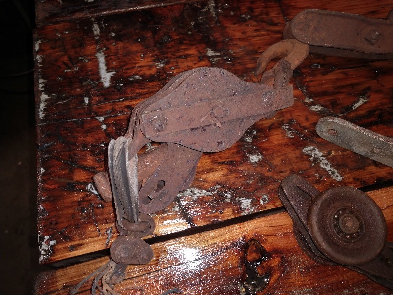 lot 30 image: Antique Pulleys and Farm Items