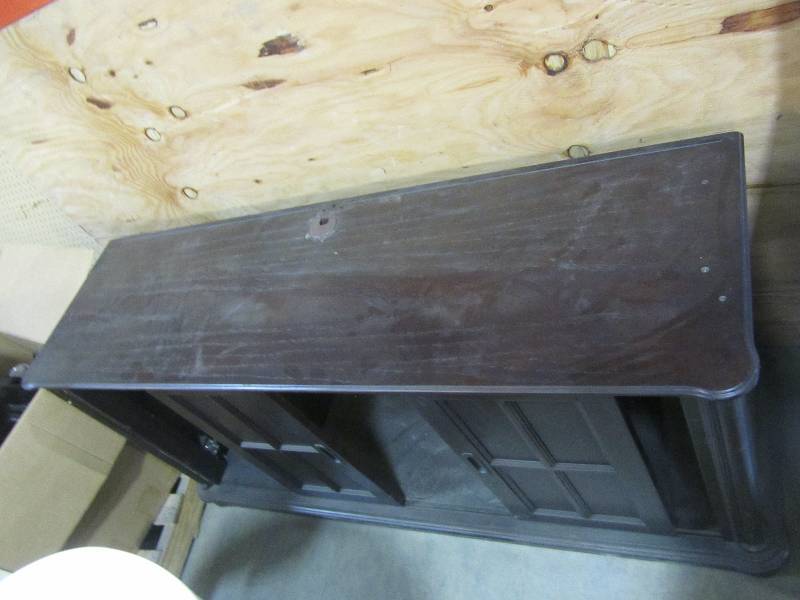 lot 23 image: Dark brown television entertainment center