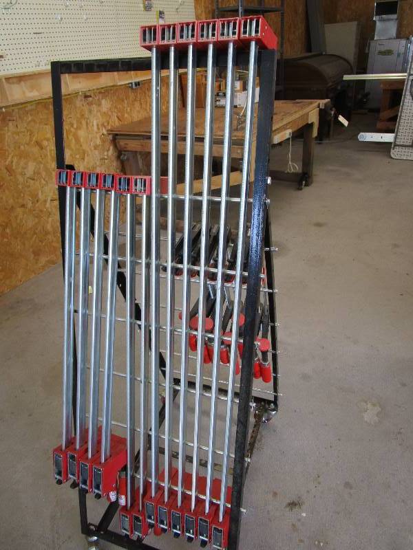 lot 73 image: Assortment of Clamps & Storage Rack