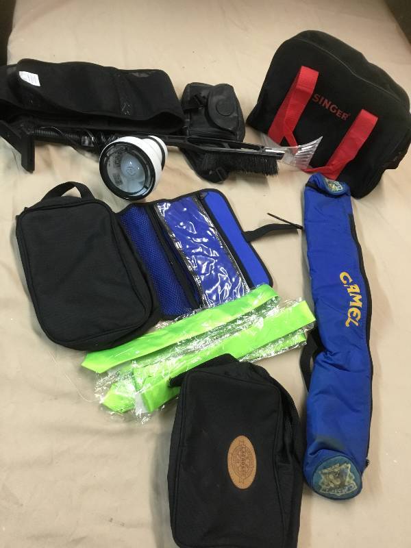 Three Neon Green Ties, a Clip on Lamp- Works, Wind Shield Scraper, a Fanny Pack, Two Small Bags Bathroom Bag and a waist Trainer