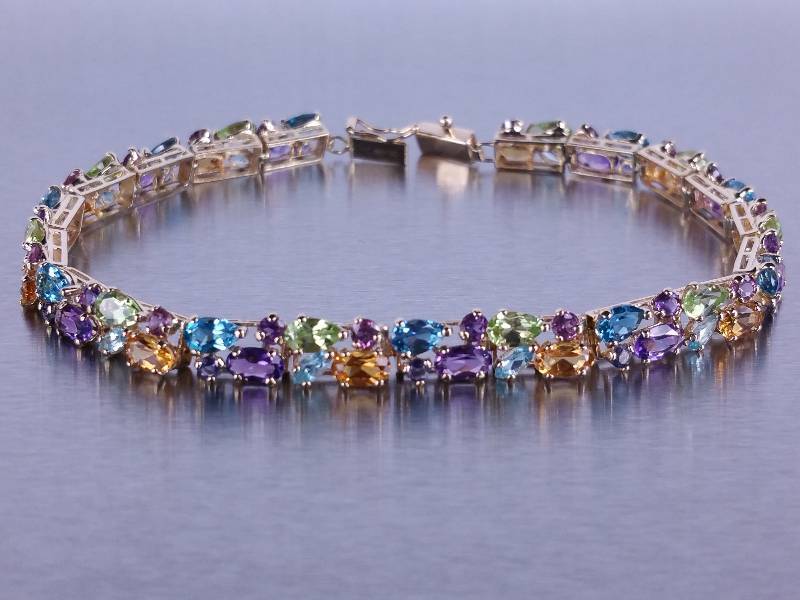 lot 26 image: Natural Multi-Colored Gem Tennis Bracelet in 14k Yellow Gold - $3650 Retail
