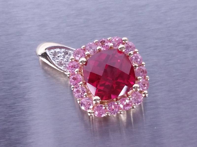 lot 56 image: 3ct Ruby and Pink Sapphire and Diamond Pendant