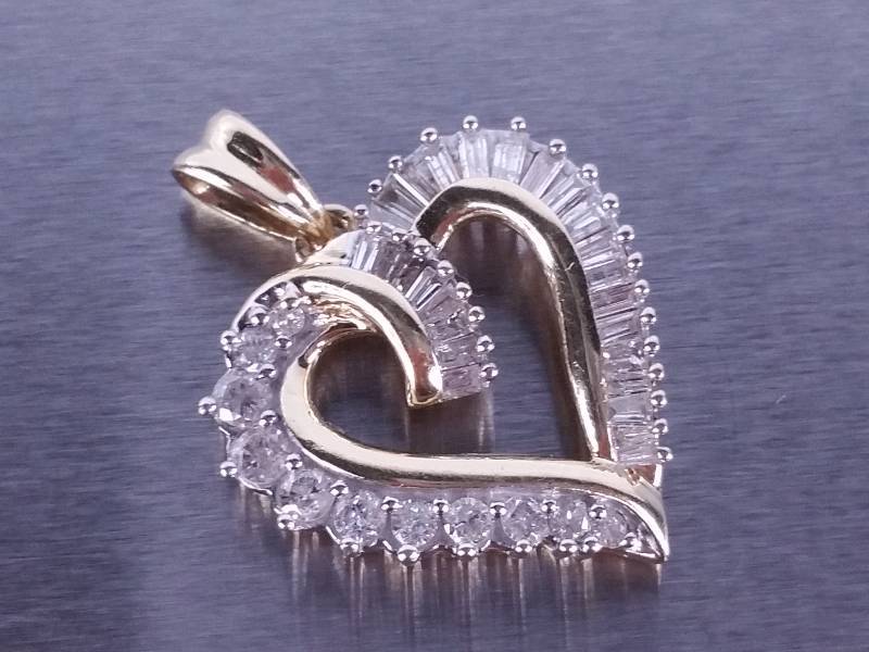 lot 59 image: Diamond Heart Pendant in Yellow Gold