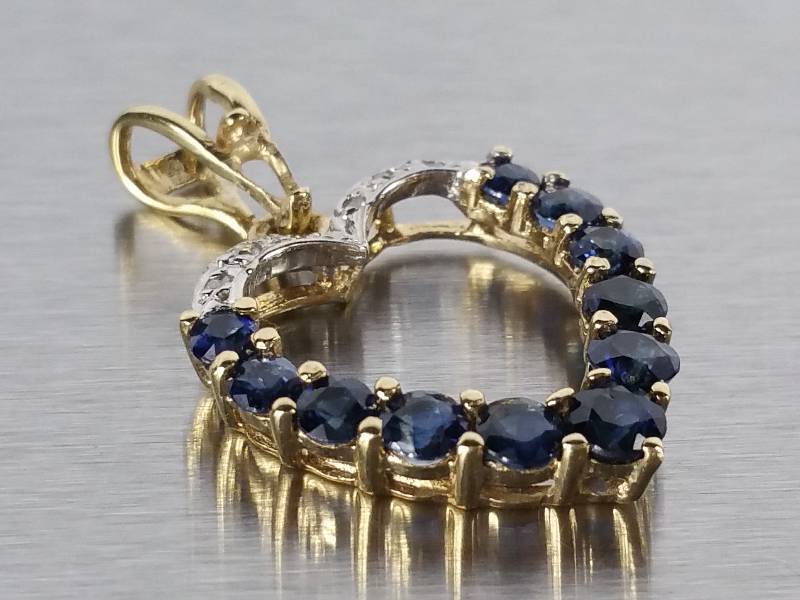 lot 77 image: Sapphire and Diamond Pendant in 14k Gold