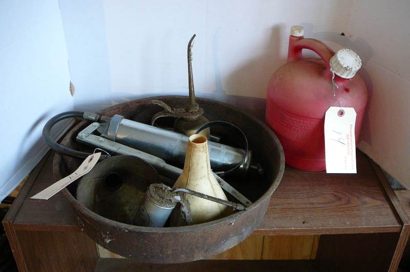 lot 14 image: Gas Can, Oil pan, Grease gun, Funnel, Oil wrench, Oil cans
