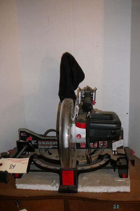 lot 84 image: Miter mate Miter saw 15amp, Laser Trac, 10 In box with manual