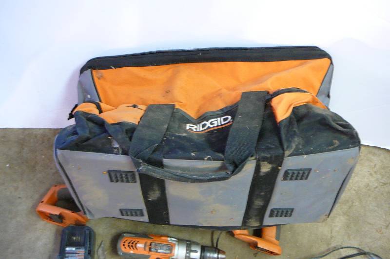lot 119 image: Ridgid 12 driver drill, recipricating saw, flashlght, charger, 2 batteries and bag