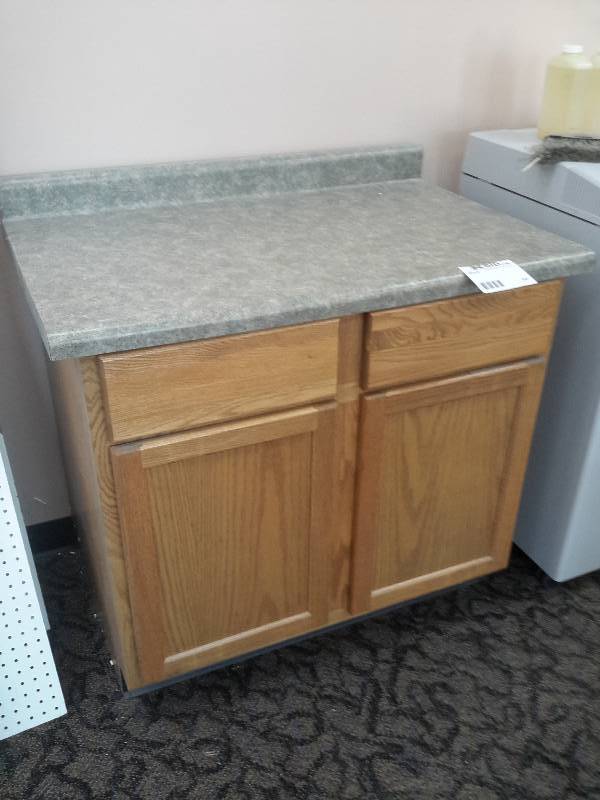 lot 40 image: Oak Cabinet with Laminate top.. Drawers and Cabinet