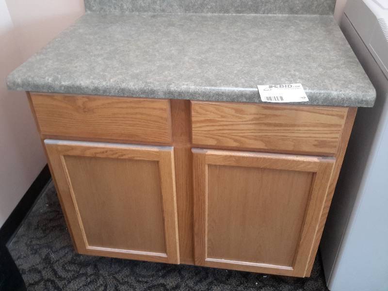 lot 39 image: Oak Cabinet with Laminate top.. Drawers and Cabinet