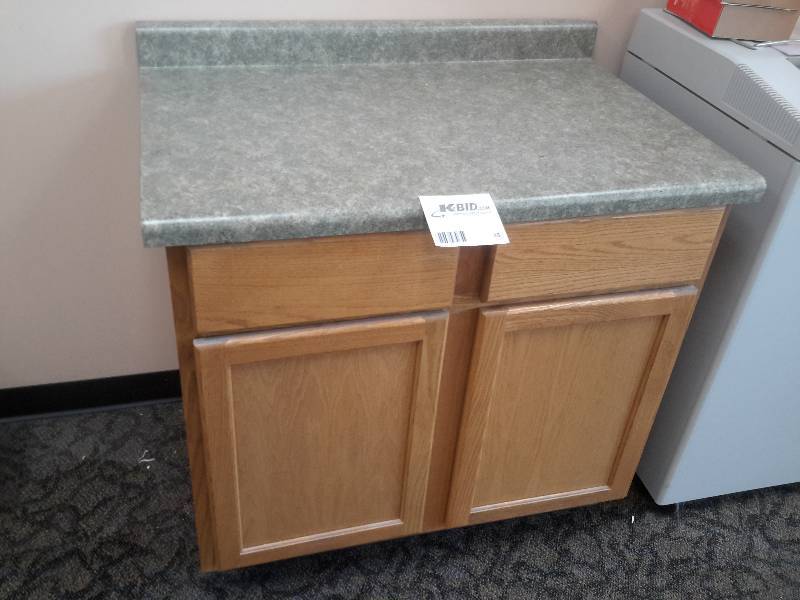 lot 38 image: Oak Cabinet with Laminate top.. Drawers and Cabinet