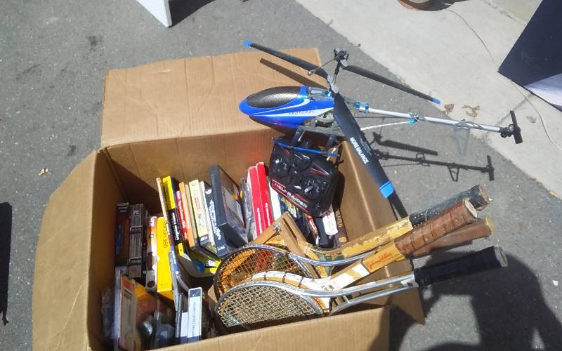 lot 12 image: Box Lot Of Computer Games, Badminton Racquets, RC Helicopter Parts