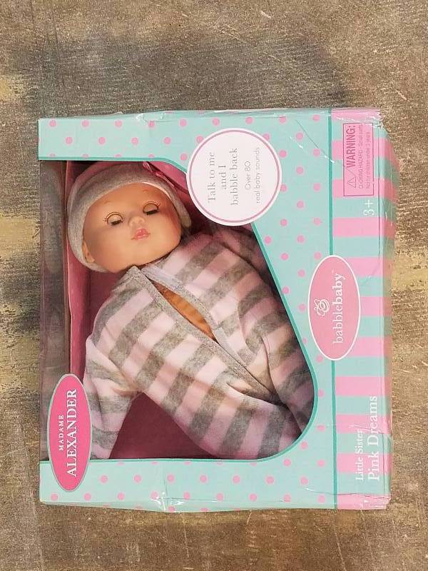 lot 467 image: Madame Alexander BabbleBaby Little Sister Doll - Pink