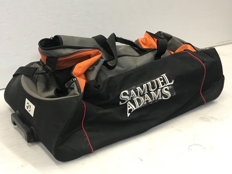 lot 23 image: Sam Adams Rolling Duffle Bag With H...