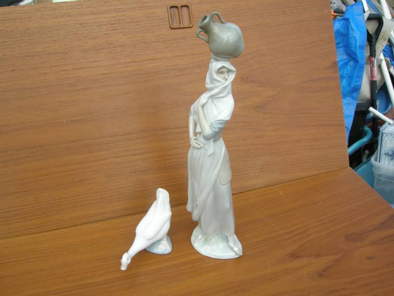 lot 60 image: Lladro Woman and Goose Figures