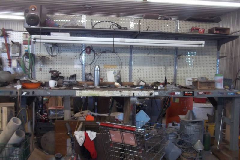 lot 70 image: Metal Shelving with Bench top and pegboard