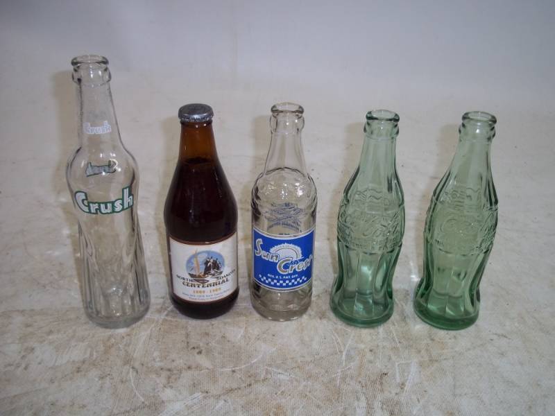 lot 10 image: Crush, Suncrest, Coca Cola, & ND Centennial Bottles