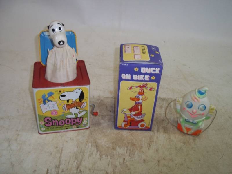 lot 14 image: Humpty Dumpty Rattle, Snoopy in the Box, Duck On Bike