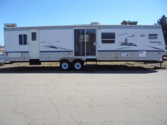 lot 1 image: 2004 Dutchman Classic Camper With Slide Out