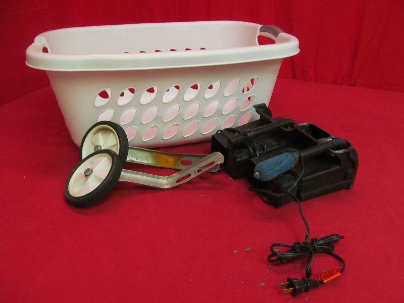 lot 23 image: aquarium pumps, training wheels, laundry basket