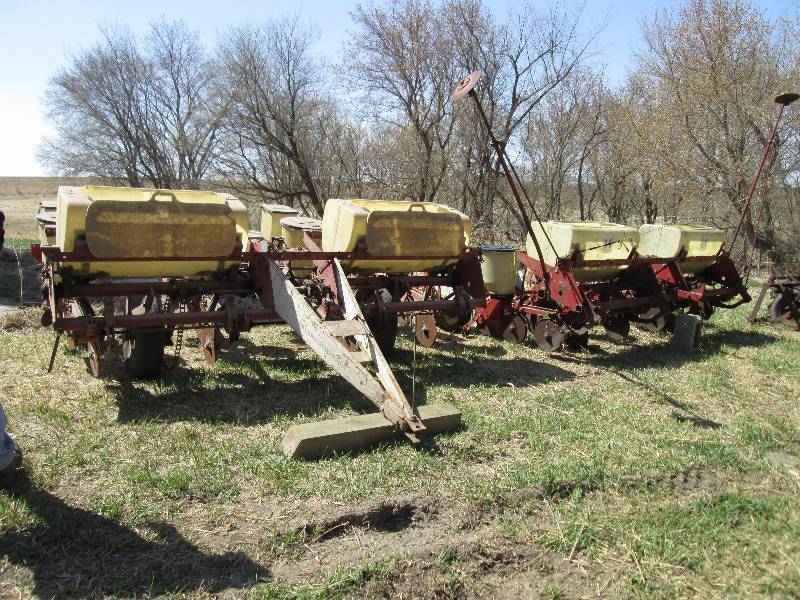 lot 64 image: working International 4 row corn pl...