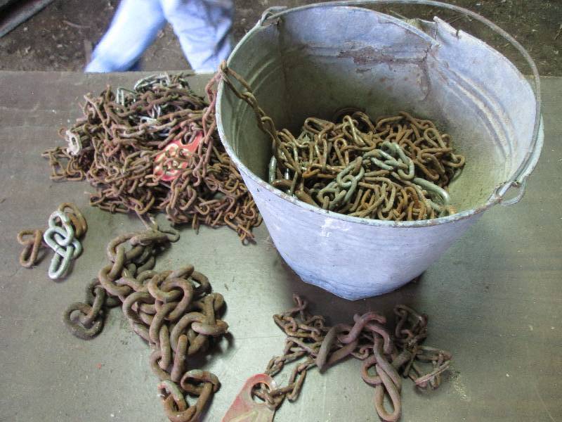 lot 131 image: Miscellaneous chains in metal pail...