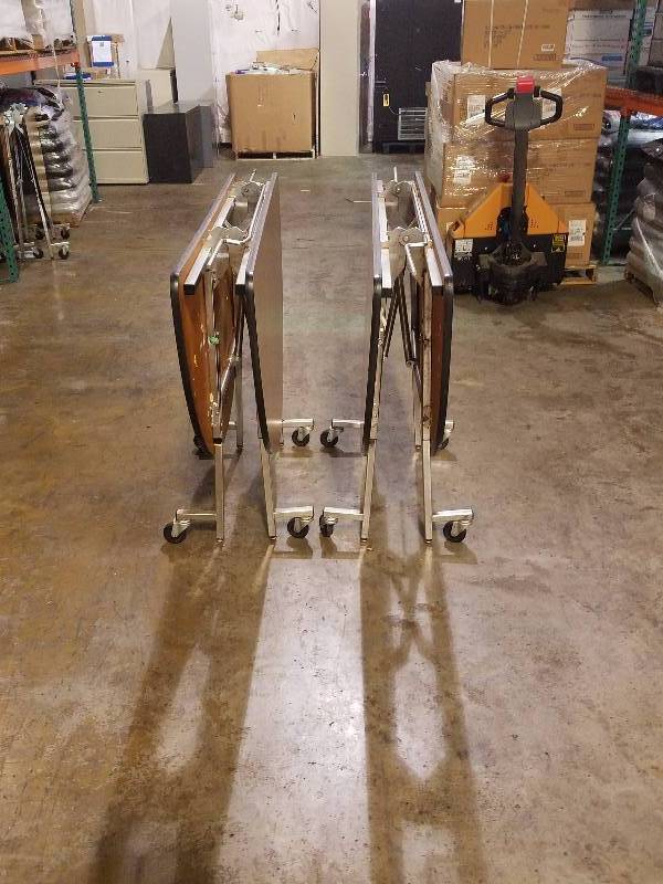 lot 73 image: 2 Folding Round Tables on Rollers