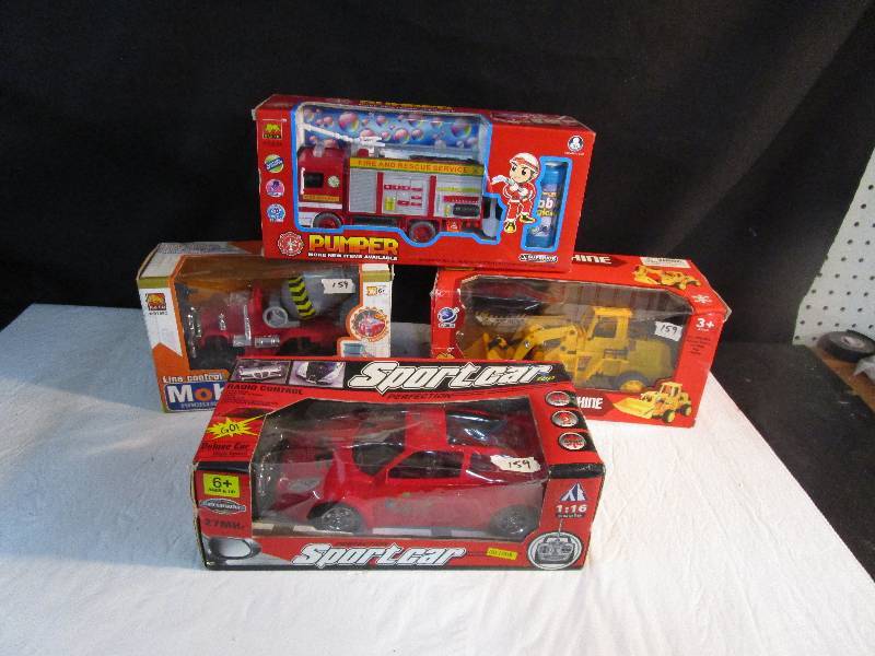 lot 82 image: 4 Toy Vehicles NIB