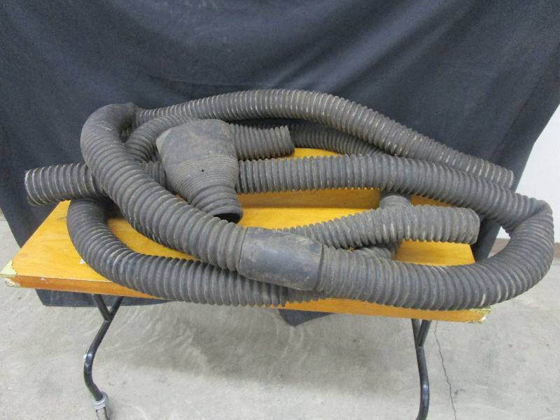 lot 67 image: Approxemently 26 ft of rubber hose used to vent exhaust