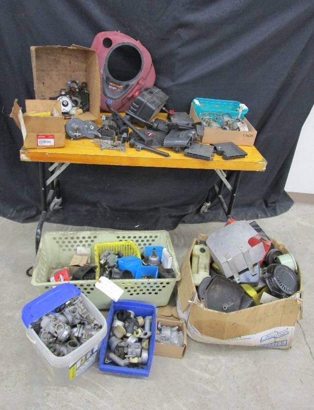 lot 75 image: Various Small Engine Parts, Carbs Carb Parts, Chain Saw Chains and More