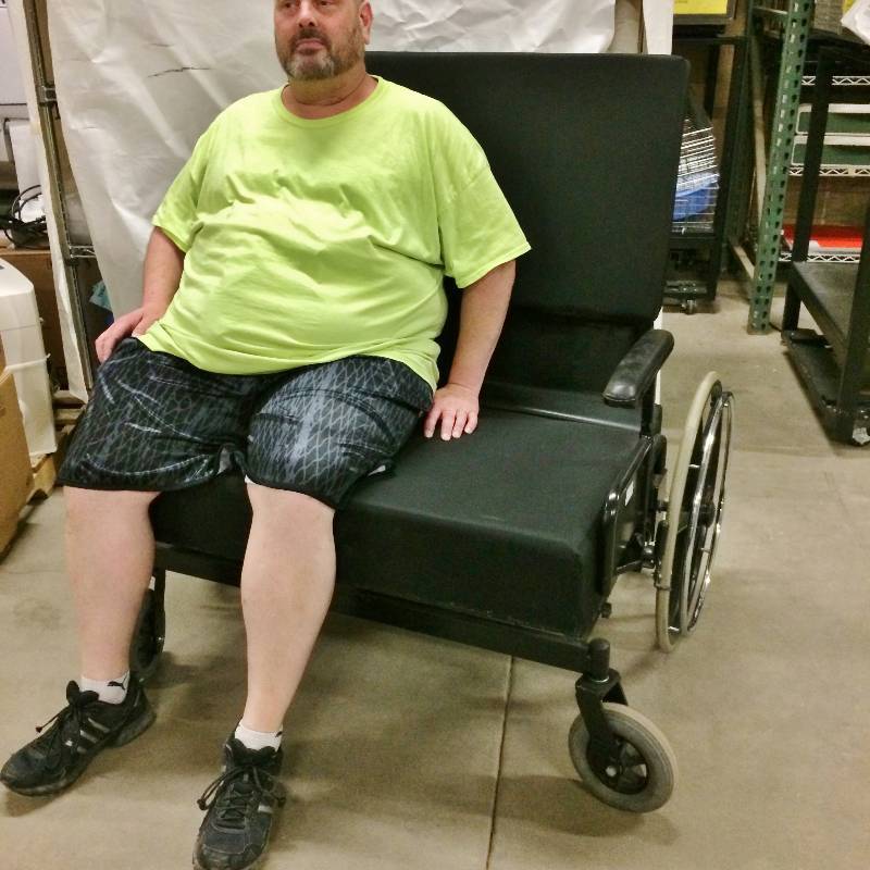 Retails New $5000 Custom Made 850 LB Capacity Convaquip Bariatric Thickly Cushioned Wheelchair - Appears Back Could Be Folded Down - Excellent Condition Except One Arm Rest Needs Screw To Hold Into Place Again.