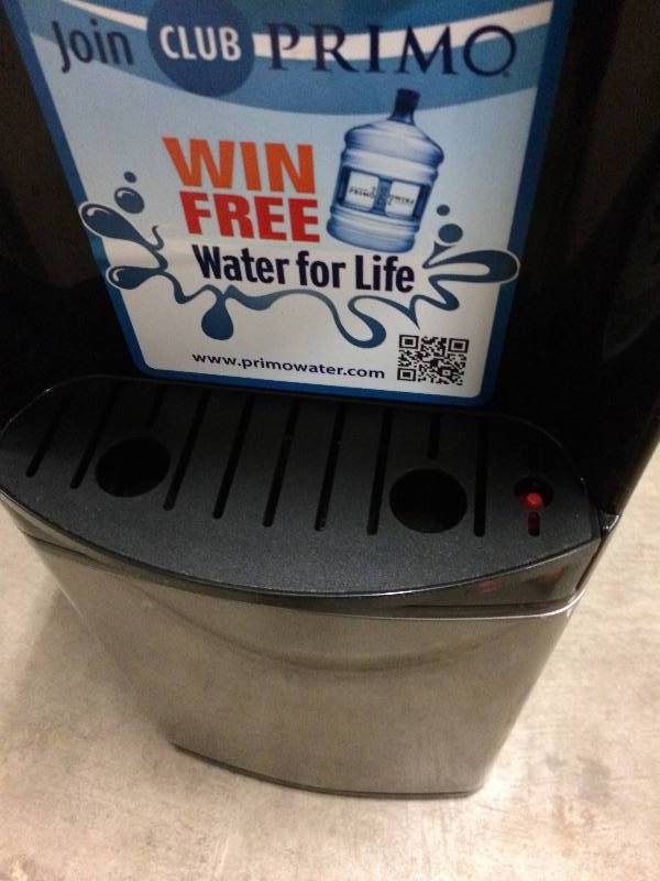 lot 26 image: Primo Black Top-loading Cold and Hot Water Cooler Energy Star 601142 - Excellent Condition