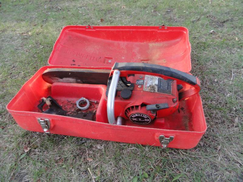 lot 649 image: Chain Saw Home lite, Model# XL2 Auto Serial 41971275 with case Works