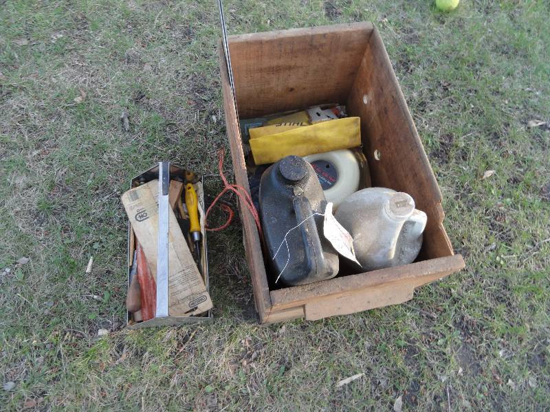 lot 652 image: Chain saw oil, Premium cutting line .065, Tools, Chain, Bars, Metal tool case, Leather gloves, Wooden box