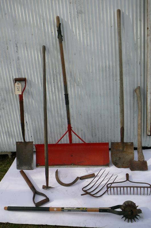 lot 724 image: Yard Tools, Snow shovel, edger, Axe, Scythes, Rake, Hoe, Dirt shovel