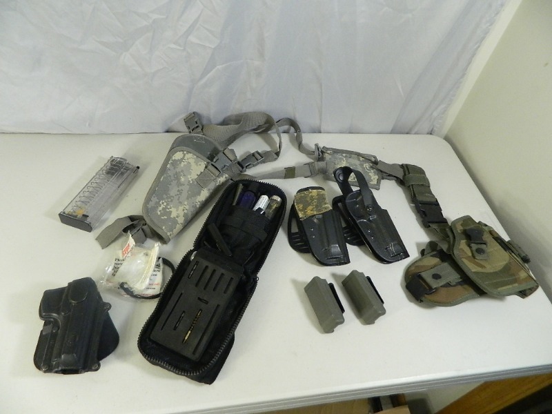 lot 125 image: Gun Holsters, Cleaning Kits, Etc