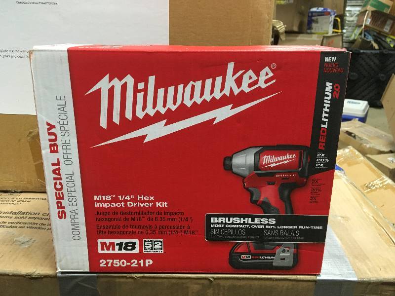 lot 31 image: Milwaukee M18 18-Volt Brushless Cordless 14 in Compact Impact Driver W (1) 2.0Ah Battery ,Charger and Tool Bag new