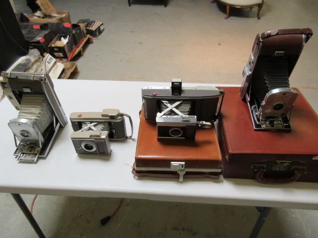 FOUR VINTAGE POLAROID CAMERAS