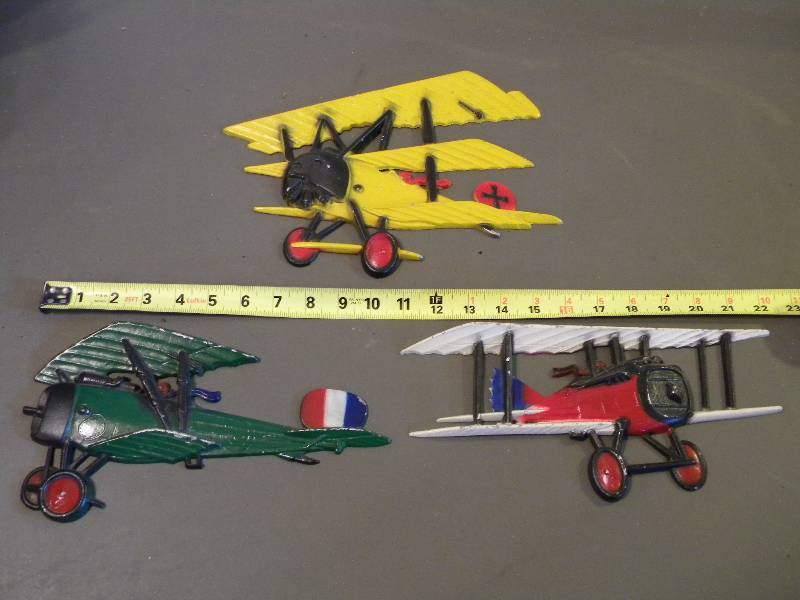 lot 109 image: Homco Metal Plane Wall Hangings
