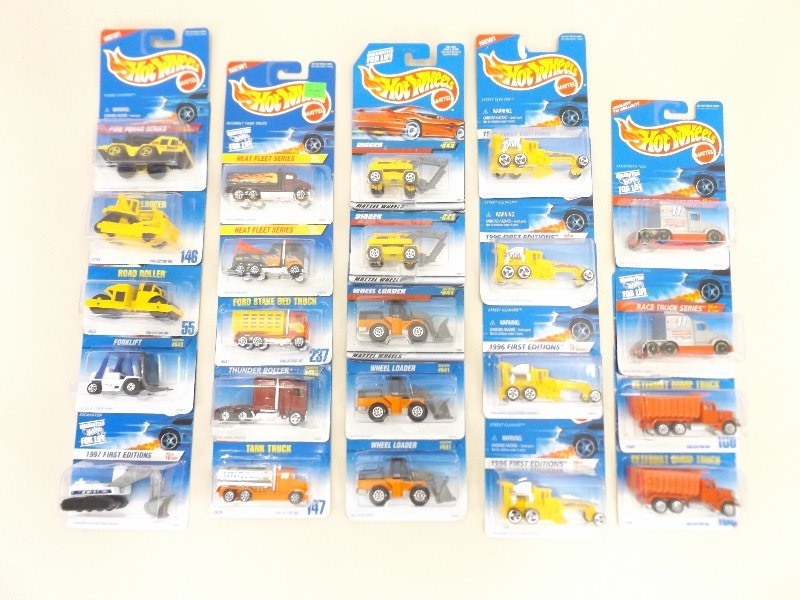 lot 26 image: 23 New in Package Hot Wheels ConstructionWork Trucks
