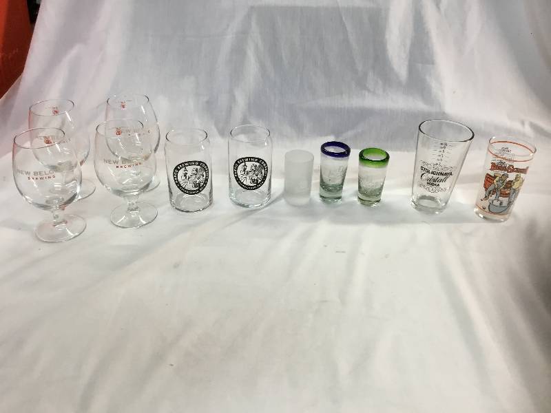 lot 59 image: Set of 4 New Belgium Glasses, Fargo Brewing Company Can Pints and 3 Shot Glasses