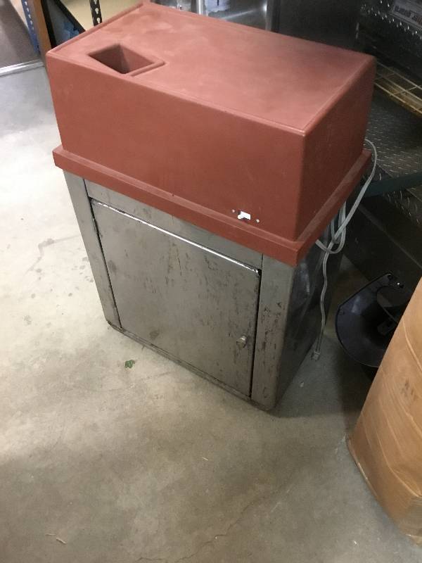 lot 71 image: Commercial Can Crusher with container below to catch the cans.