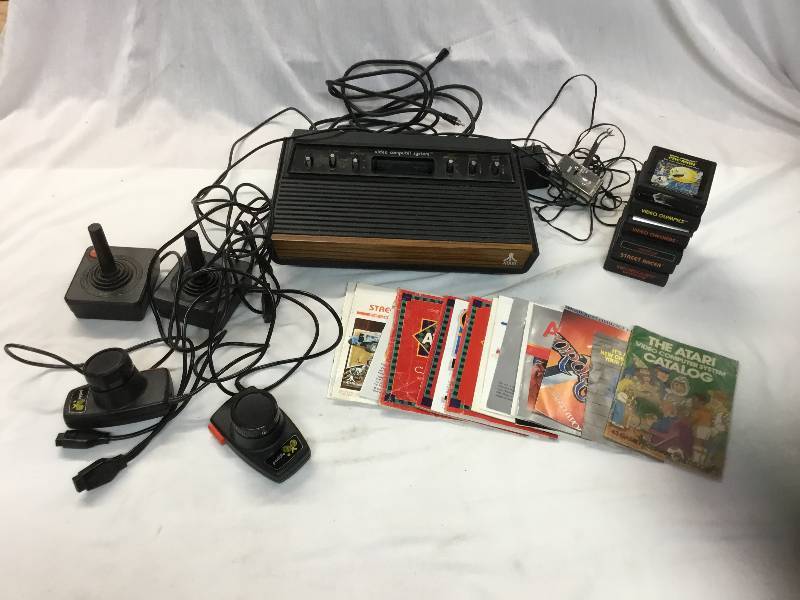 lot 75 image: Atari 2600 with 7 games 4 controllers all hook ups.
