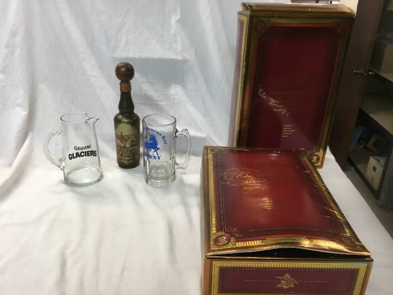 lot 142 image: Two Mugs, Leather Wrapped Glass Bottle, Budweiser Millennium Set