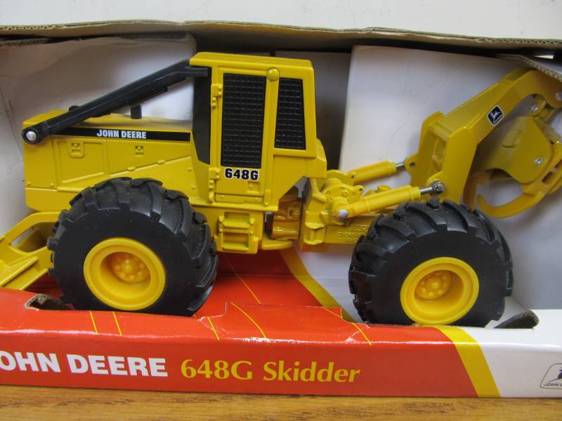 lot 152 image: NIB Diecast John Deere 648G Skidder