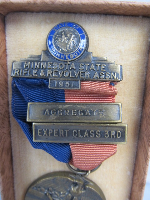 lot 180 image: Vintage MN Marksmanship Award Medal wCase