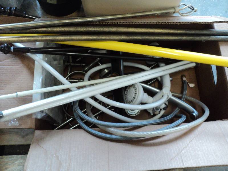 2 boxes of plumbing supplies, curta...
