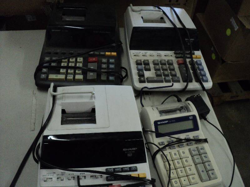 4 electric calculators - tested and...