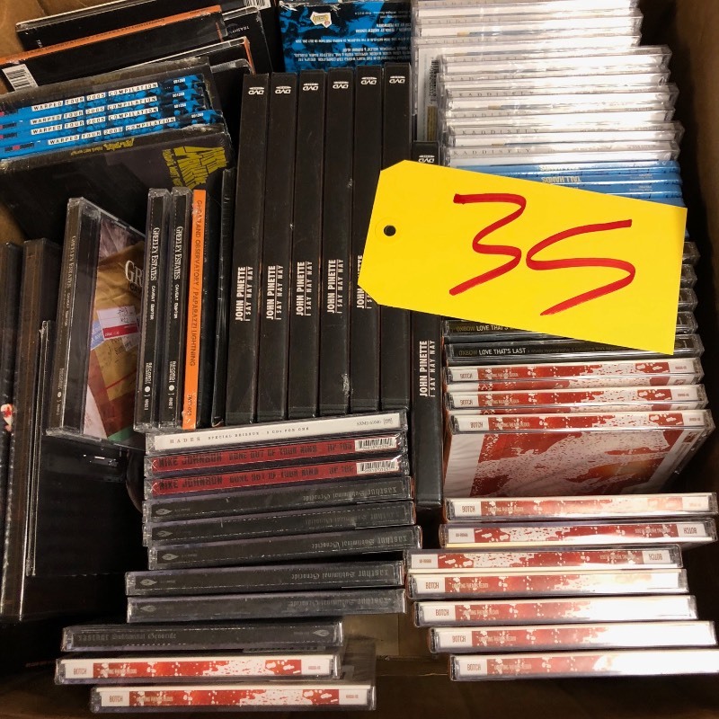 lot 35 image: Large Lot of Sealed Mint DVDs & CDs - Arctic Monkeys