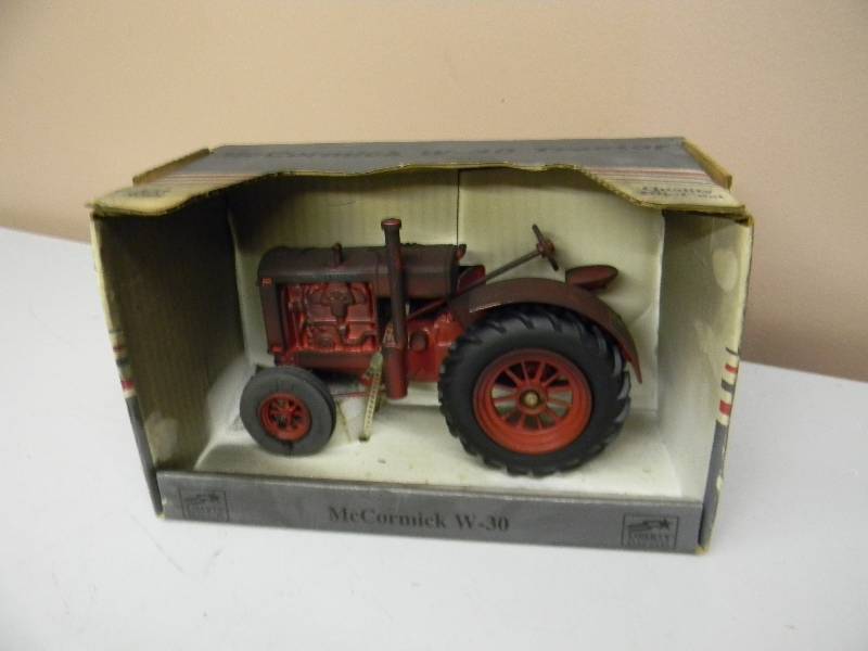 lot 33 image: SPEC CAST McCORMICK W-30 TRACTOR - 116 SCALE IN BOX - SEE PICTURES