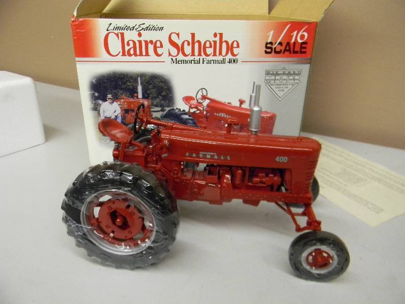 lot 52 image: (GREAT PIECE NEW IN THE BOX) - LIMITED EDITION CLAIRE SCHEIBE MEMORIAL FARMALL 400 - 116 SCALE - DIE CAST METAL - SPEC CAST - SEE PICTURES